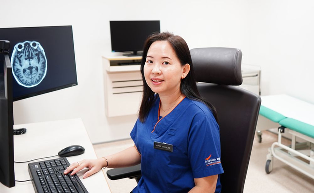 Neuroscientist Adeline Ng at her computer