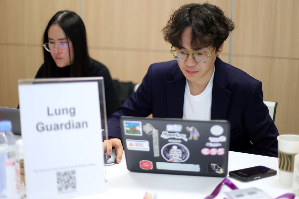 Hard at work fine-tuning their idea