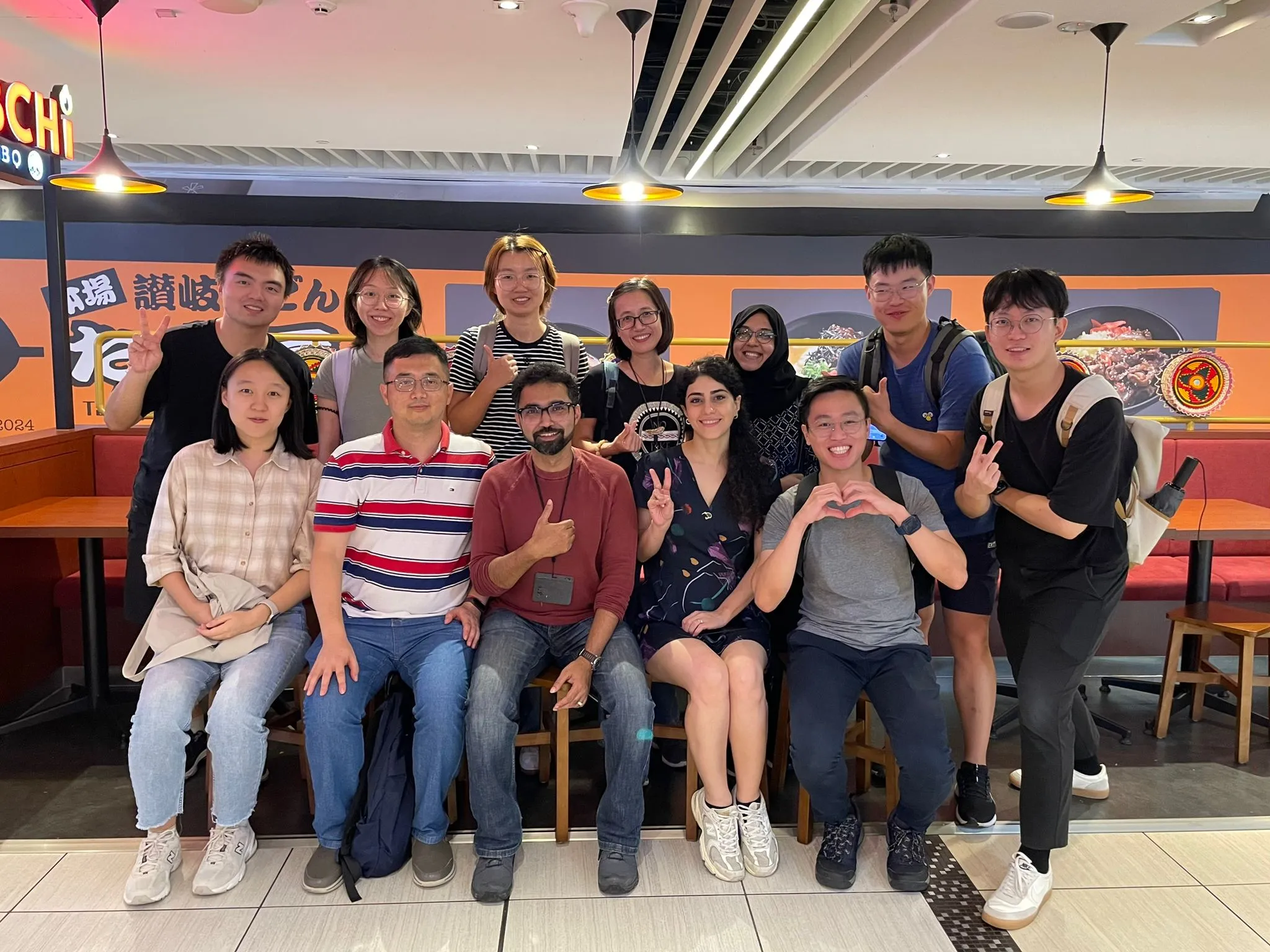 Cao pictured here with his lab // Credit: Courtesy of Cao Mian