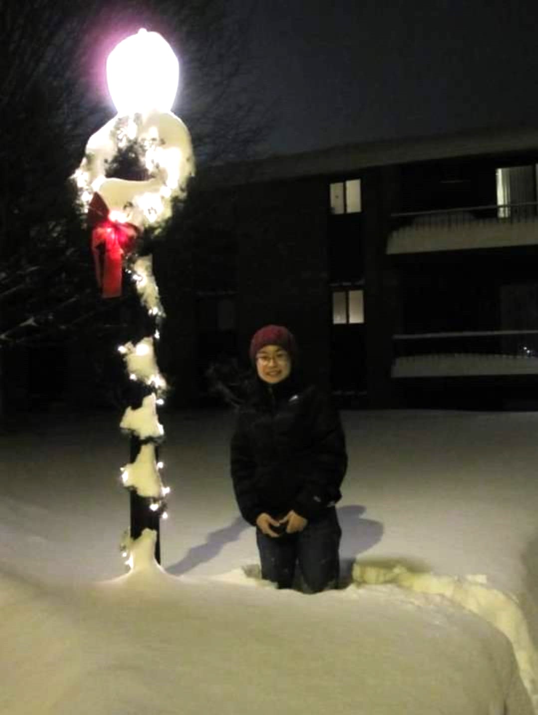 Tay imitates a human popsicle in the thigh-deep Syracuse winter snow. // Credit: Tay Hwee Goon