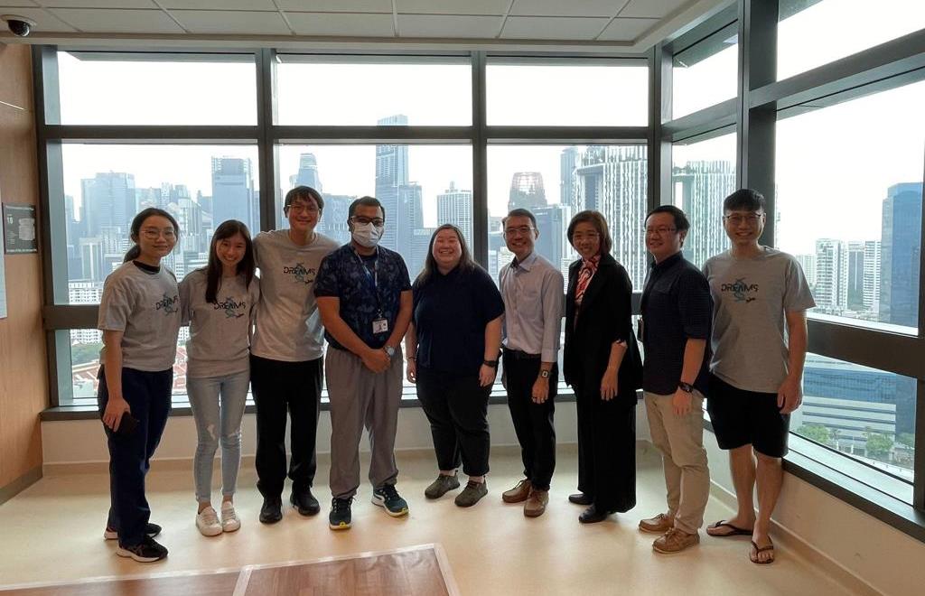 A group photo of the organising committee comprising of the NCCS team and teachers from the school who are joined by the students